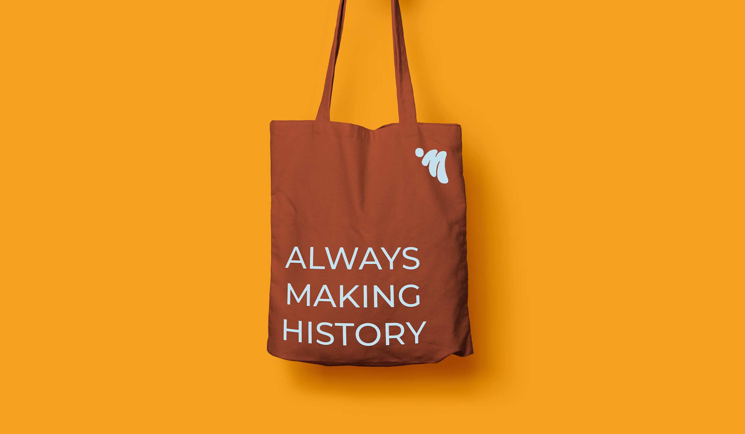 red tote bag with slogan